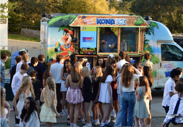 Students lineup for the shaved ice truck at the Spring Fling.